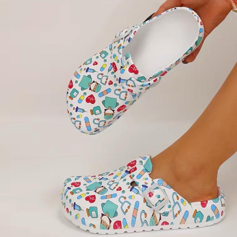 Medical print slip-on clogs with thick cushioned platform sole.