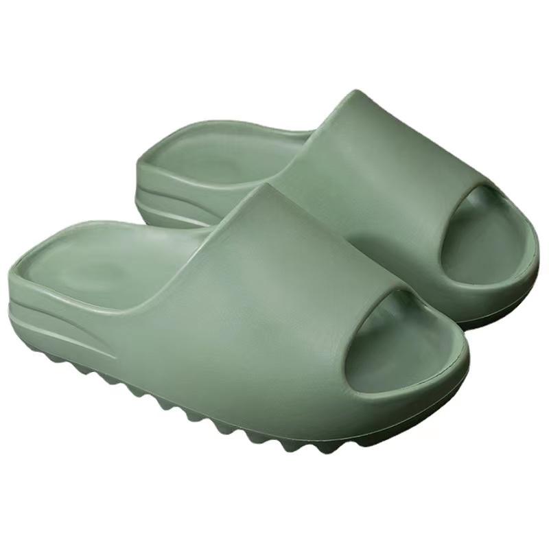 Women's green slip-on comfort slides with open-toe design.