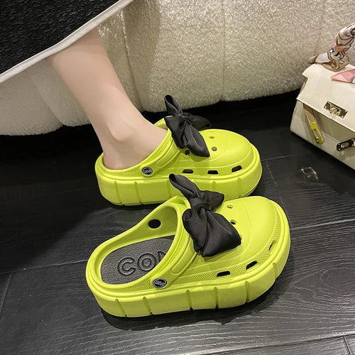 Green EVA comfort sandals with cushioned sole for women.