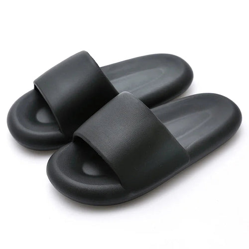 Soft slip-on slippers with durable non-slip bottom.