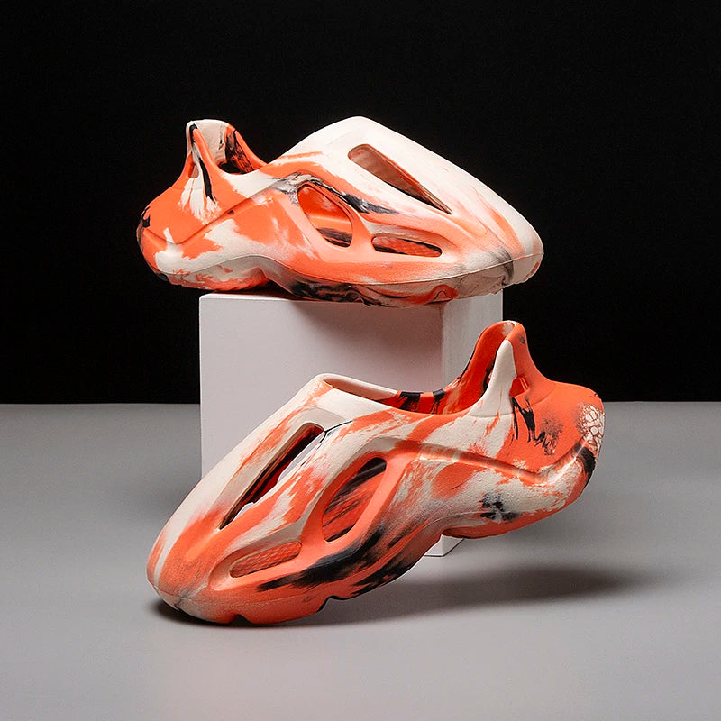 Orange camouflage comfort clogs with thick cushioned platform sole.