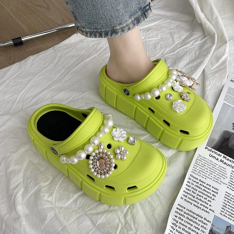 Women's green platform slides with soft footbed for all-day comfort.