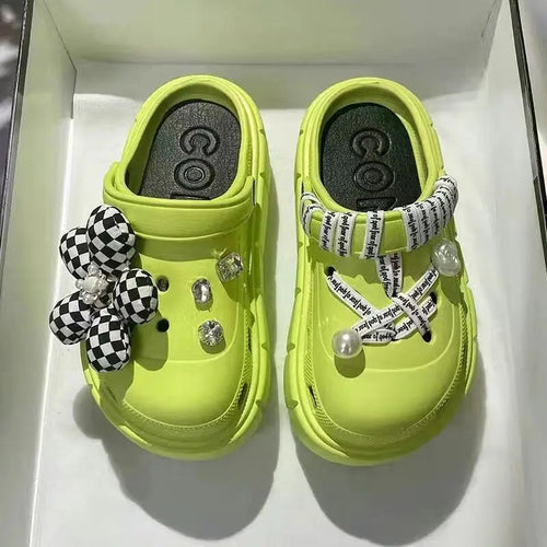 Comfortable green slides for women suitable for everyday wear.