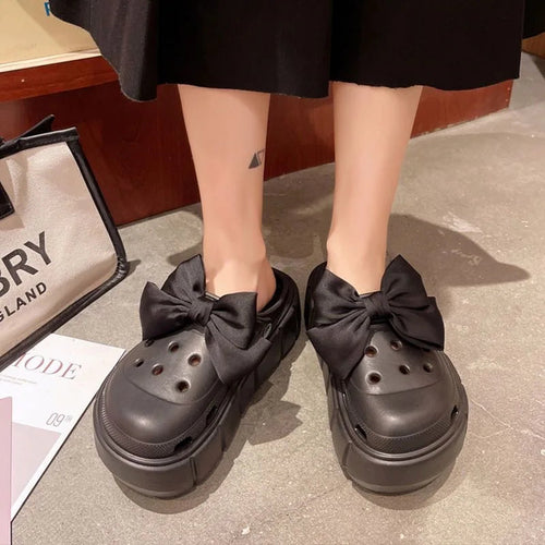 Soft cushioned EVA slides for women with modern platform style.