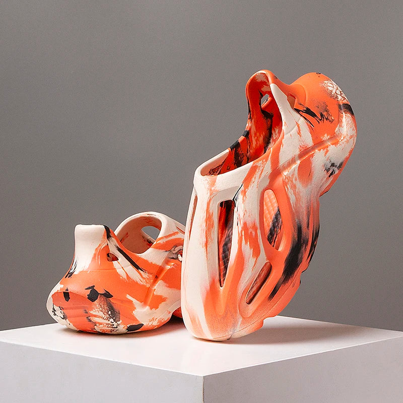 Unisex camouflage EVA platform clogs with breathable cutout design.