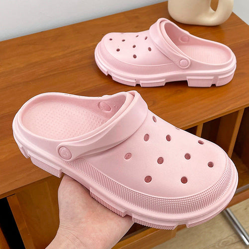 Unisex pink EVA garden clogs with lightweight comfort and breathable ventilation holes.